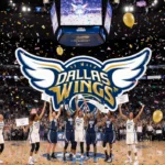 Dallas Wings players celebrate with confetti while fans hold signs and a screen shows the team logo