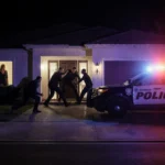 Three intruders break into luxury home front door with LAPD lights and alarmed residents watching.