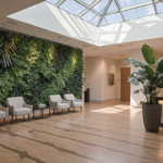 Hospital lobby greets patients with natural light and a living wall.