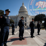 Line of California National Guard soldiers standing at attention with bright LA sunshine and a subtle Trump logo behind City