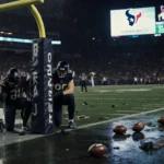 Justin Herbert looks dejected with slumped Charger teammates near the goalpost while C.J. Stroud raises arms on Texans side a