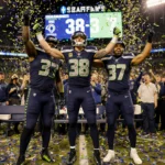 Seattle Seahawks captain Sam Darnold celebrates overtime victory with Jaxon Smith‑Njigba and Eric Saubert in confetti fans