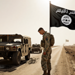 U.S. soldier gazes down at his boots with a deserted road and abandoned Humvee hinting at an ambush