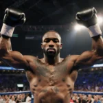 Terence Crawford, a boxer, stands center ring with arms raised and gaze on gloves in dim stadium lights