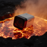 USGS camera struggling in molten lava with glowing crimson flow and golden crater rim