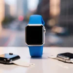 Multiple Apple Watches rest on modern desk with SE 3 standing out in silver case and blue strap