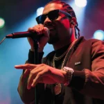 A$AP Rocky performing on SNL with colorful lights and microphone showing his dynamic stage presence