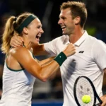 Maddison Inglis and Jason Kubler celebrating their Australian Open qualification with joyful embrace and tennis racket in han