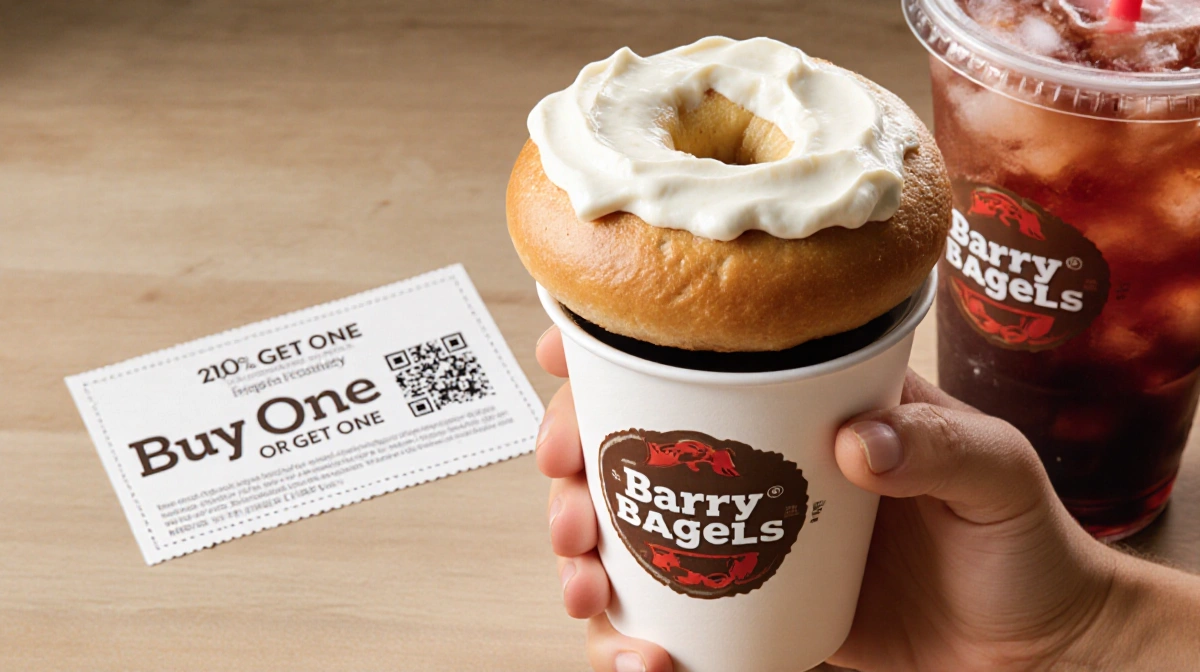 Customer holding coffee with Barry Bagels bagel and fountain drink showing buy-one-get-one coupon in background