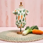 College student studying at desk with laptop and coffee surrounded by books and notes.