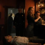 Billy Bob Thornton stands shocked behind bar with body on floor and shadowy figure looming