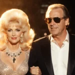 Candy and Aaron Spelling stand arm-in-arm with Beverly Hills glamour and warm golden lighting showing 1980s elegance