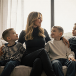 Céline Dion gently touching her sons