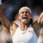 Coco Gauff raises racket with frustration and golden light illuminating her during an intense Australian Open moment