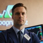 Stock trader celebrating in front of CTSH logo with financial charts on large screen