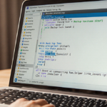 Computer screen showing backup tool command line settings with abandoned laptop keyboard and warm glow.