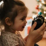 Little girl sits on mom