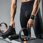 Fitness enthusiast stands with Apple Watch and Hyperice Normatec Go boot and surrounded by high‑tech workout gear.