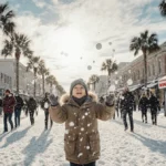 Child throwing snowballs with palm trees and snowy buildings showing rare Florida winter storm