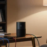 Google Nest WiFi Pro router sits on table with colorful cables connected to devices and warm lamp light illuminating the inte