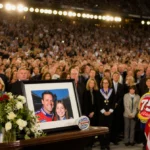 Greg Biffle memorial service honors racing legend with framed photo and flowers on podium