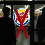 Teenage silhouette stands back from entrance with bold red X marking danger and shadowy figure looming in background