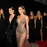 Hailey Bieber and Jennifer Lopez walking the red carpet with glamorous gowns and celebrity guests nearby