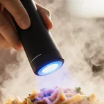 Person holds handheld gluten detector over pasta bowl with blue LED light showing positive result