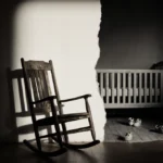Old rocking chair casting long shadows with torn family photo and baby shoes visible behind