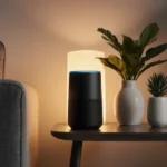 IKEA smart speaker sits on minimalist coffee table with warm lighting and plants creating cozy atmosphere