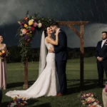 Couple’s Sunny Wedding Hit by Surprise Storm-Guests Cheer Through Soaked Vows
