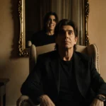 Jack Osbourne sits in armchair with Ozzy