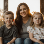 Jenelle Evans smiles with her children on a wooden porch under a sunset glow