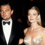 Leonardo DiCaprio and Gwyneth Paltrow reuniting at red carpet event with his hand on her shoulder and paparazzi flashes behin