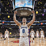 Luka Doncic raising arms in triumph with confetti and a scoreboard showing 129-118 with golden glow