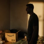 Man stands in anguish near motionless body with shattered Amazon delivery and golden shadows