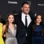 Matt Damon poses with his four daughters on the red carpet with wife Luciana and daughters in bright yellow and silver gowns