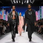 Maya and Levon Hawke walking the Milan runway with Rihanna and A$AP Rocky at the end while neon city lights glow behind