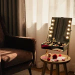 Mirror jewelry cabinet reflects trinkets with rose petals and Valentine