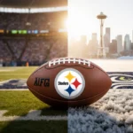 Football rests between Steelers and Seahawks logos with soft golden light highlighting playoff excitement