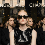 Nicole Kidman sits front row at Paris Fashion Week with black Chanel gown and oversized sunglasses under golden light