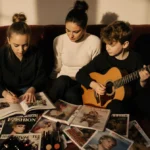 Nicole Richie relaxing on velvet couch with kids and guitar showing intimate family bonding