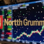 Northrop Grumman logo glows red and gold over dynamic stock market ticker with rising charts showing investment success