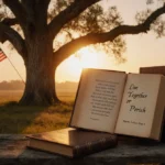 Majestic oak tree stands against golden sunset with American flag waving from branch and books on bench below