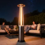Modern patio heater glowing warmly with guests relaxing on sofa and lush plants surrounding cozy outdoor seating area