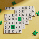 Puzzle grid displays letters and numbers with bright yellow background and scattered green and yellow puzzle pieces