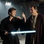 Anakin and Obi-Wan rehearse lightsaber duel with Hayden Christensen gesturing to Robert De Niro watching in background