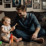 Robert Pattinson holding his daughter