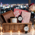 Gift basket arranged with leather wallet candle watch and soft candle glow for a romantic setting