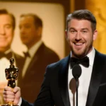Seth Rogen holding Golden Globe trophy with cheeky grin and Steve Martin with Martin Short visible in background